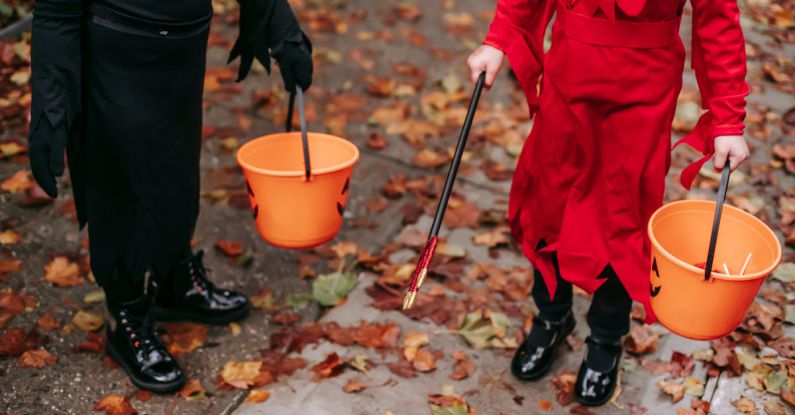 Street Magic Tricks - Kids walking on street with buckets on Halloween