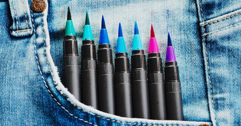 Magic Tools - A pair of jeans with colorful pens in them